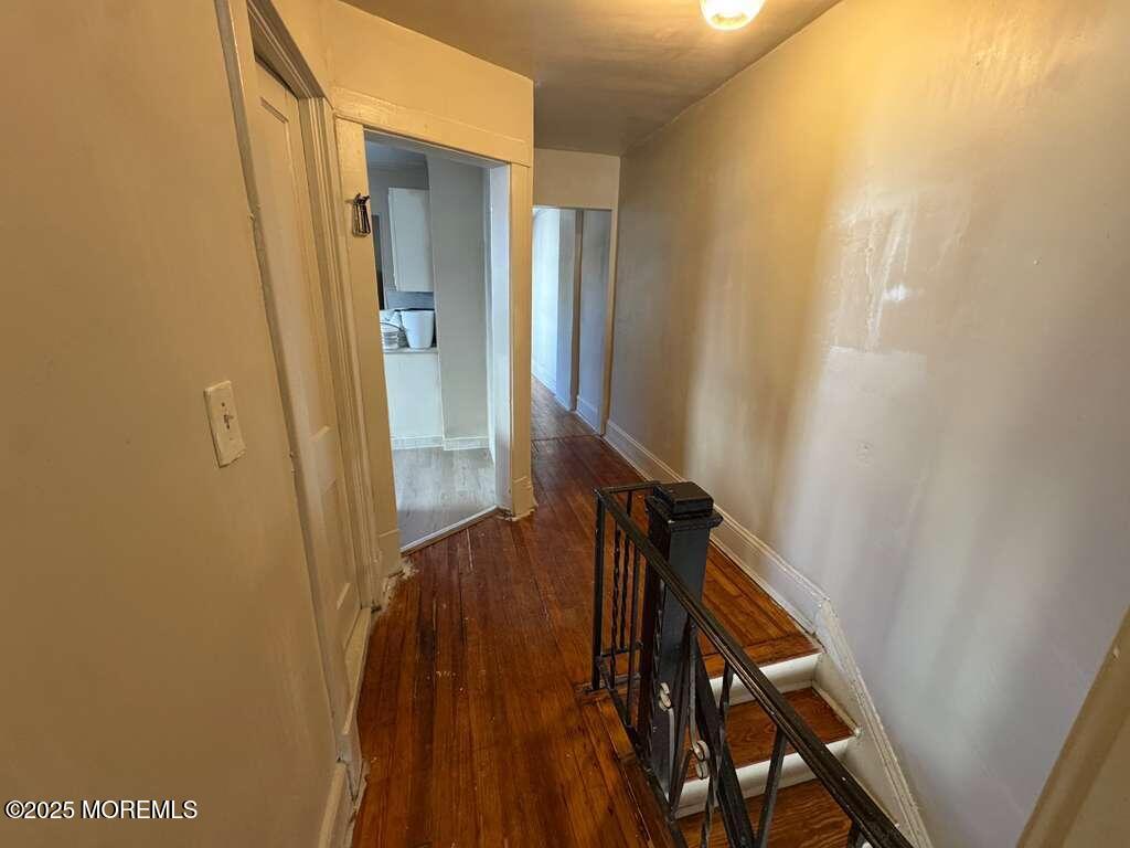 110 Rector Street, Unit 2 Perth Amboy, NJ 08861 - Photo 4 of 6 a view of hallway with stairs