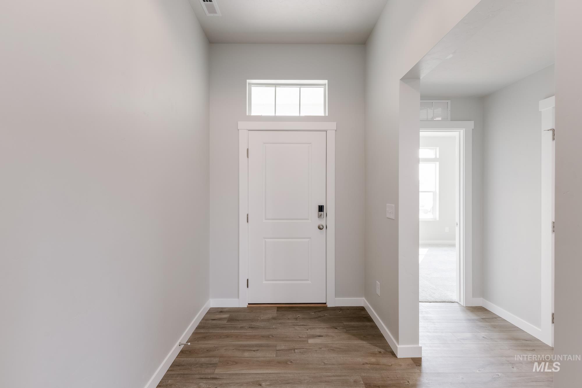 5315 Castleton Avenue Nampa, ID 83686 - Photo 3 of 19 Foyer featuring light wood-style flooring and baseboards