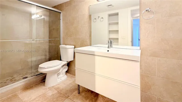a bathroom with a toilet sink and a shower