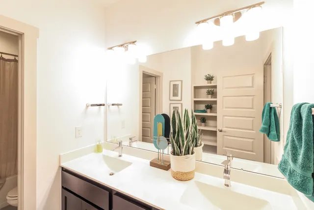 a dining room with a table and chairs