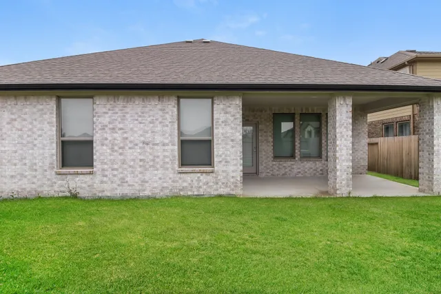 a front view of house with yard and porch