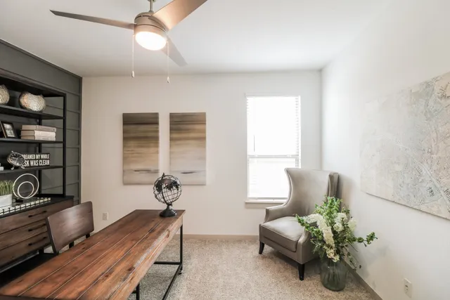 a bedroom with furniture and a window