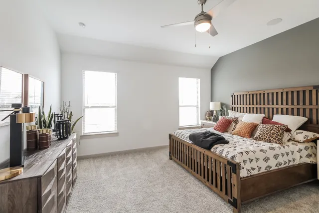 a bed room with bed and a window