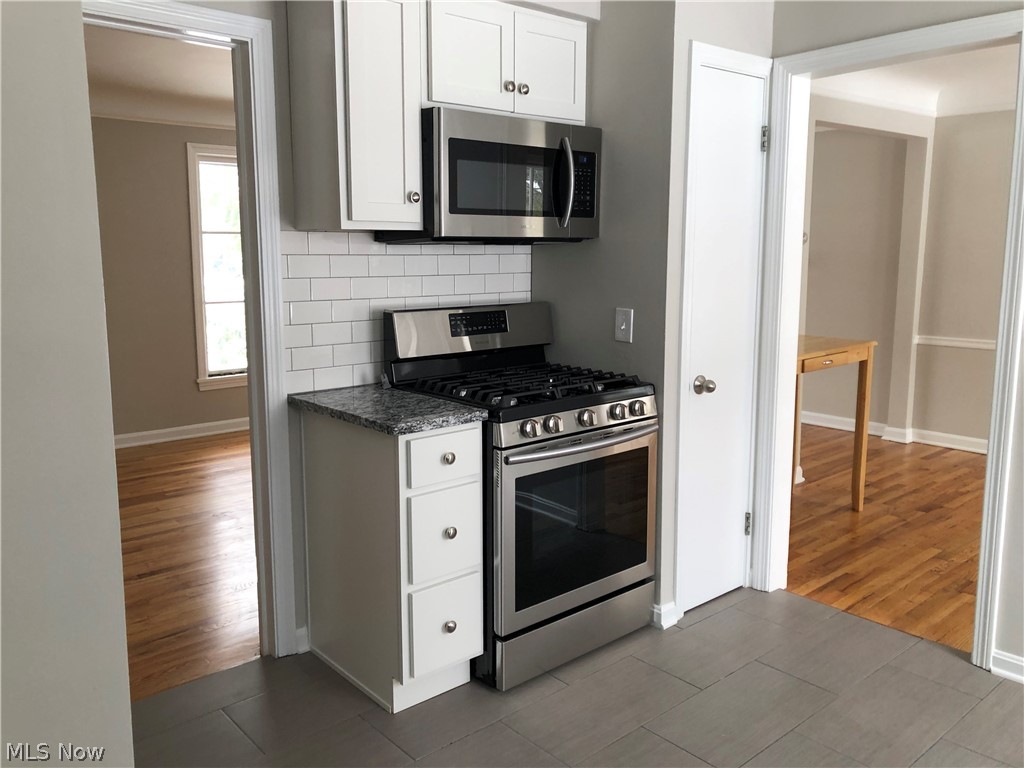 1255 Brainard Road Lyndhurst, OH 44124 - Photo 6 of 30 The gas Samsung oven is nestled by more storage and topped by a microwave