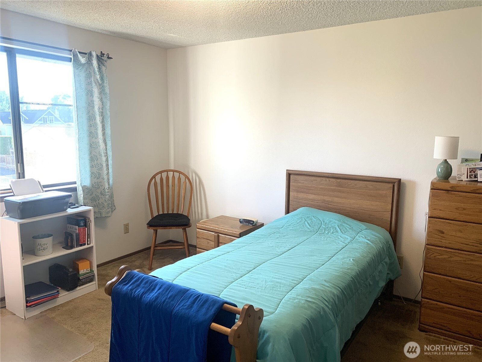 416 Meade Avenue Sumner, WA 98390 - Photo 12 of 39 a bedroom with a bed and a window