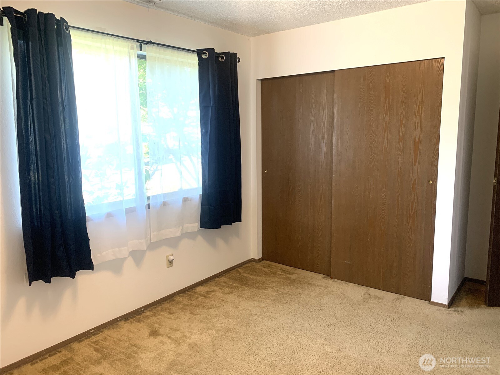 416 Meade Avenue Sumner, WA 98390 - Photo 15 of 39 a view of an empty room with a window