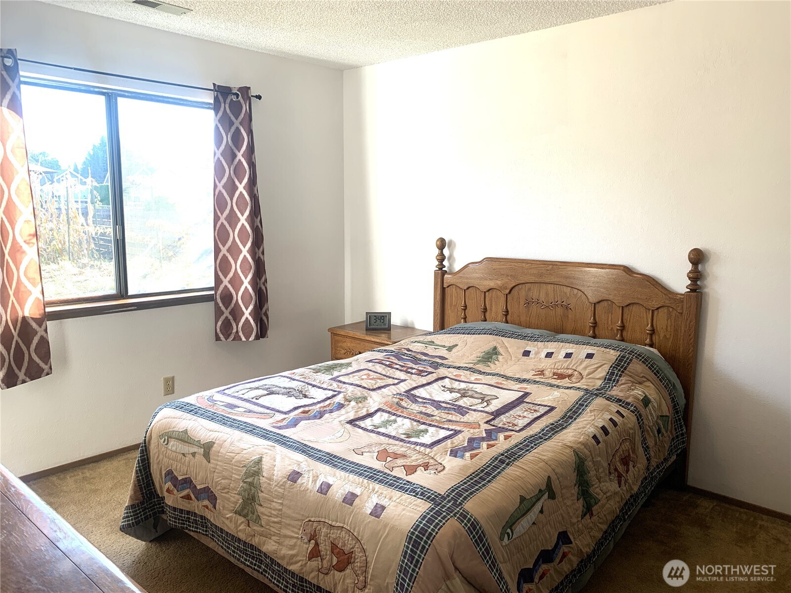 416 Meade Avenue Sumner, WA 98390 - Photo 16 of 39 a bedroom with a bed and a window