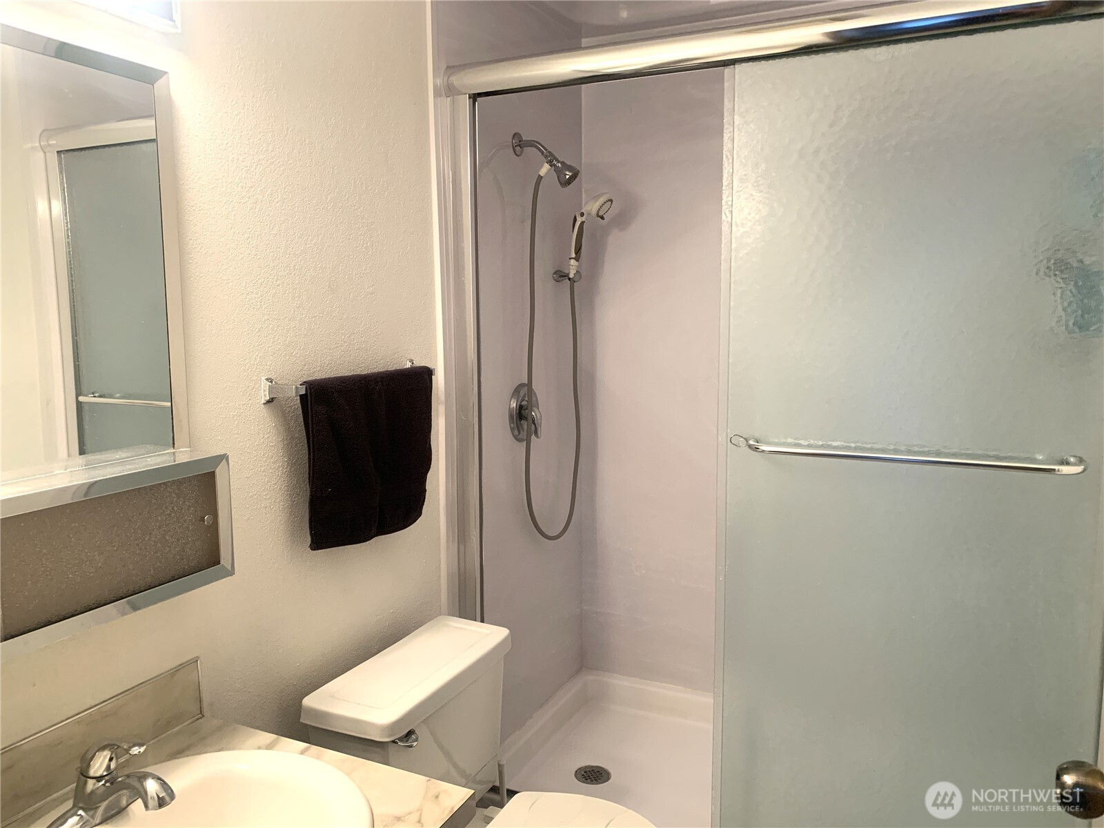 416 Meade Avenue Sumner, WA 98390 - Photo 18 of 39 a bathroom with a shower toilet and sink