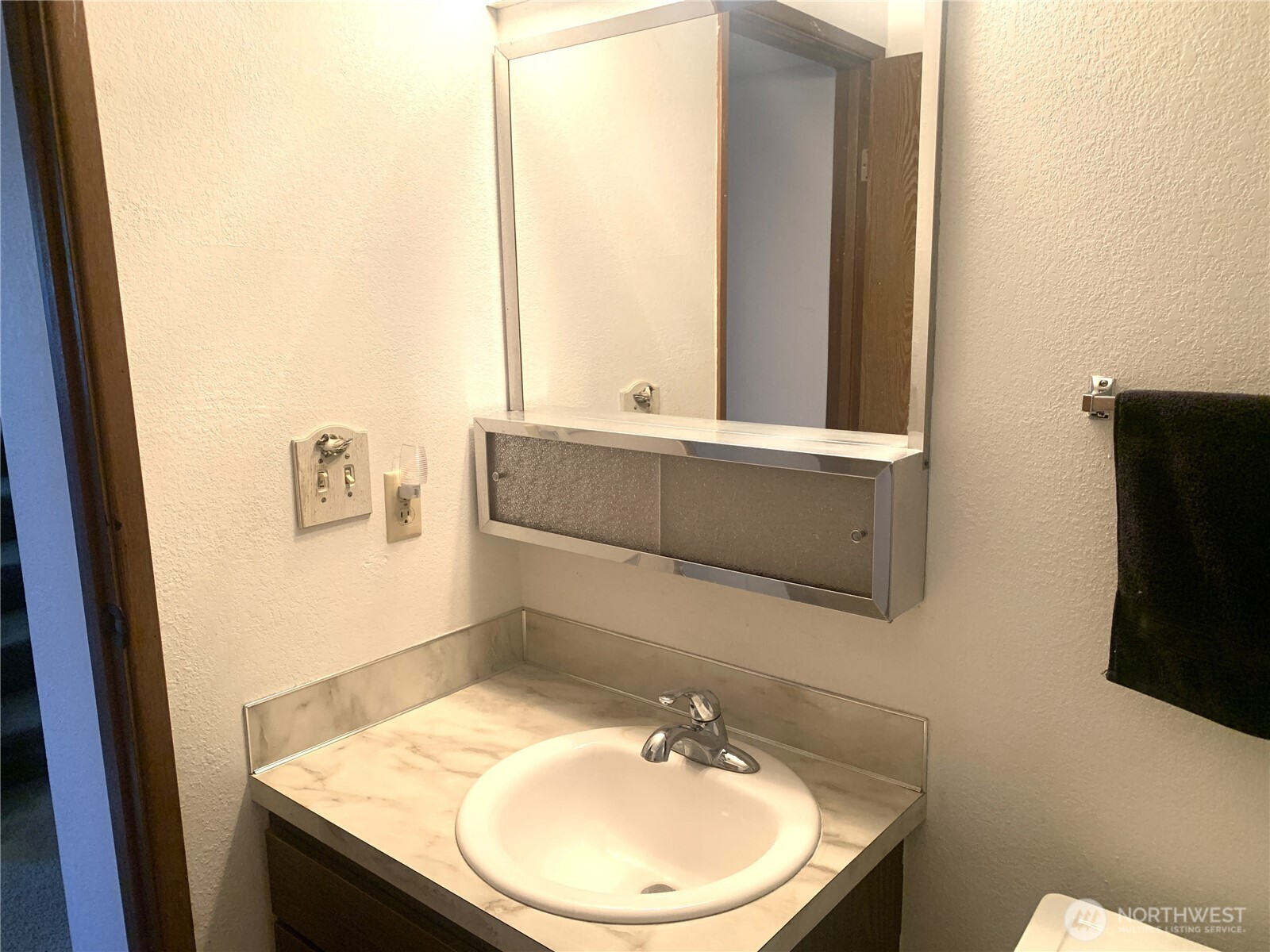 416 Meade Avenue Sumner, WA 98390 - Photo 19 of 39 a bathroom with a sink a mirror and a toilet
