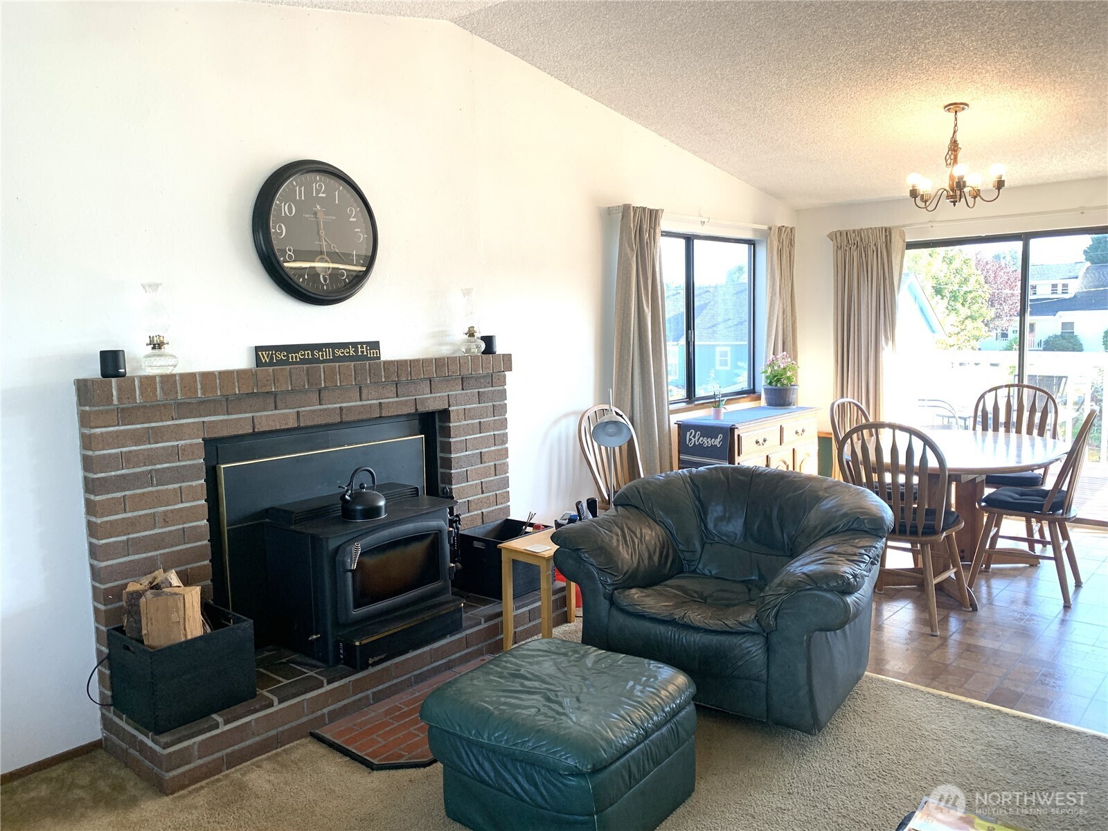 416 Meade Avenue Sumner, WA 98390 - Photo 3 of 39 a living room with furniture a fireplace and a large window