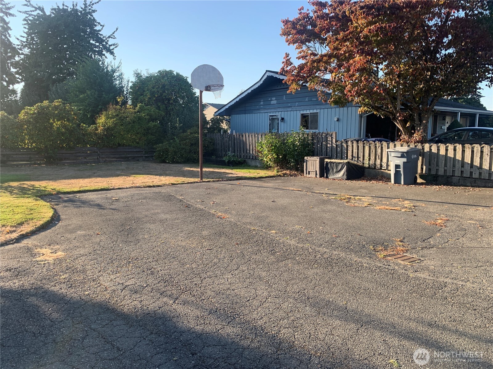 416 Meade Avenue Sumner, WA 98390 - Photo 39 of 39 a view of a house with backyard and fence