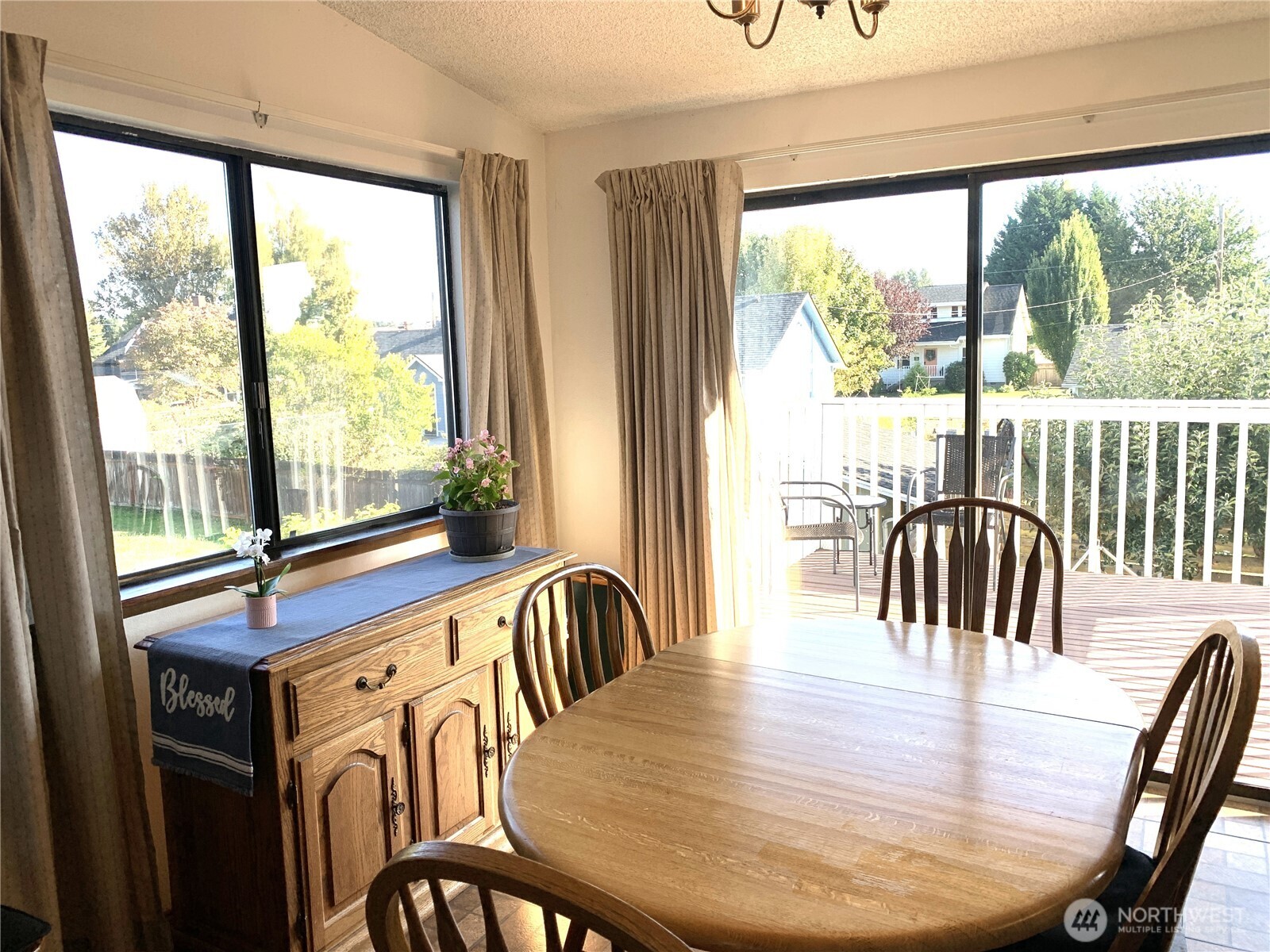 416 Meade Avenue Sumner, WA 98390 - Photo 5 of 39 a view of a dining room with furniture window and wooden floor