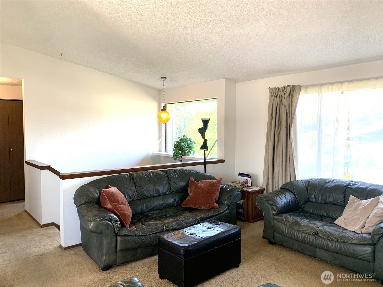 416 Meade Avenue Sumner, WA 98390 - Photo 6 of 39 a living room with furniture and a large window