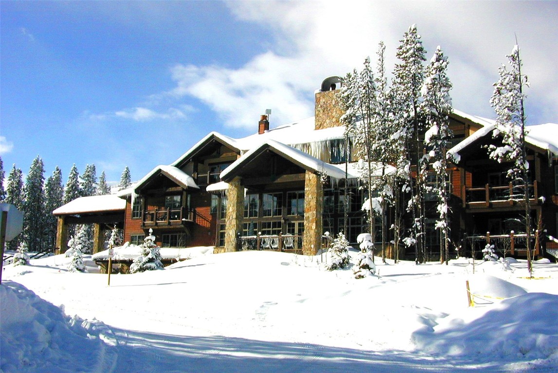 75 Snowflake Drive, Unit 836 Breckenridge, CO 80424 - Photo 1 of 14 a view of a house with snow on the ground