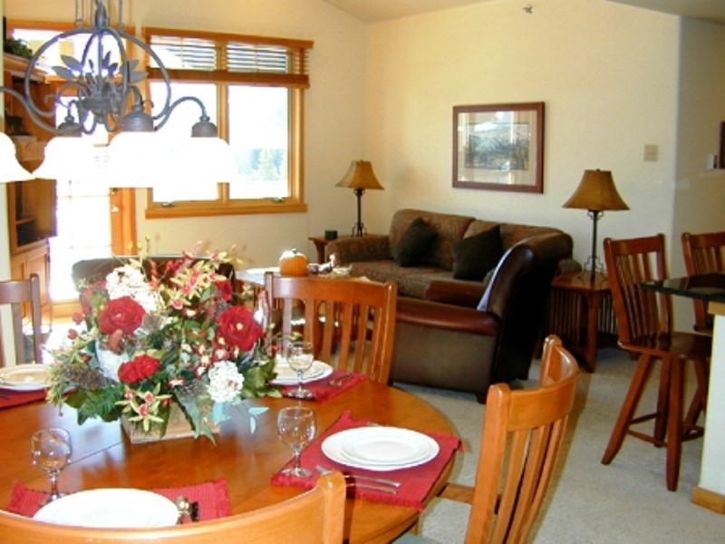 75 Snowflake Drive, Unit 836 Breckenridge, CO 80424 - Photo 3 of 14 a living room with furniture and a table