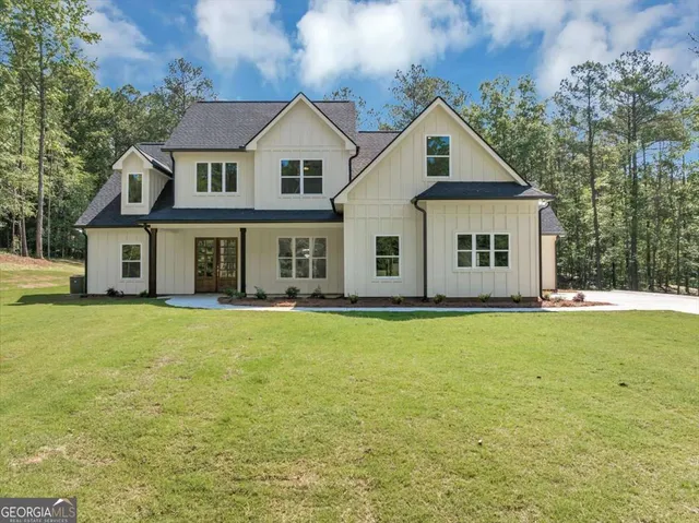 a front view of a house with yard