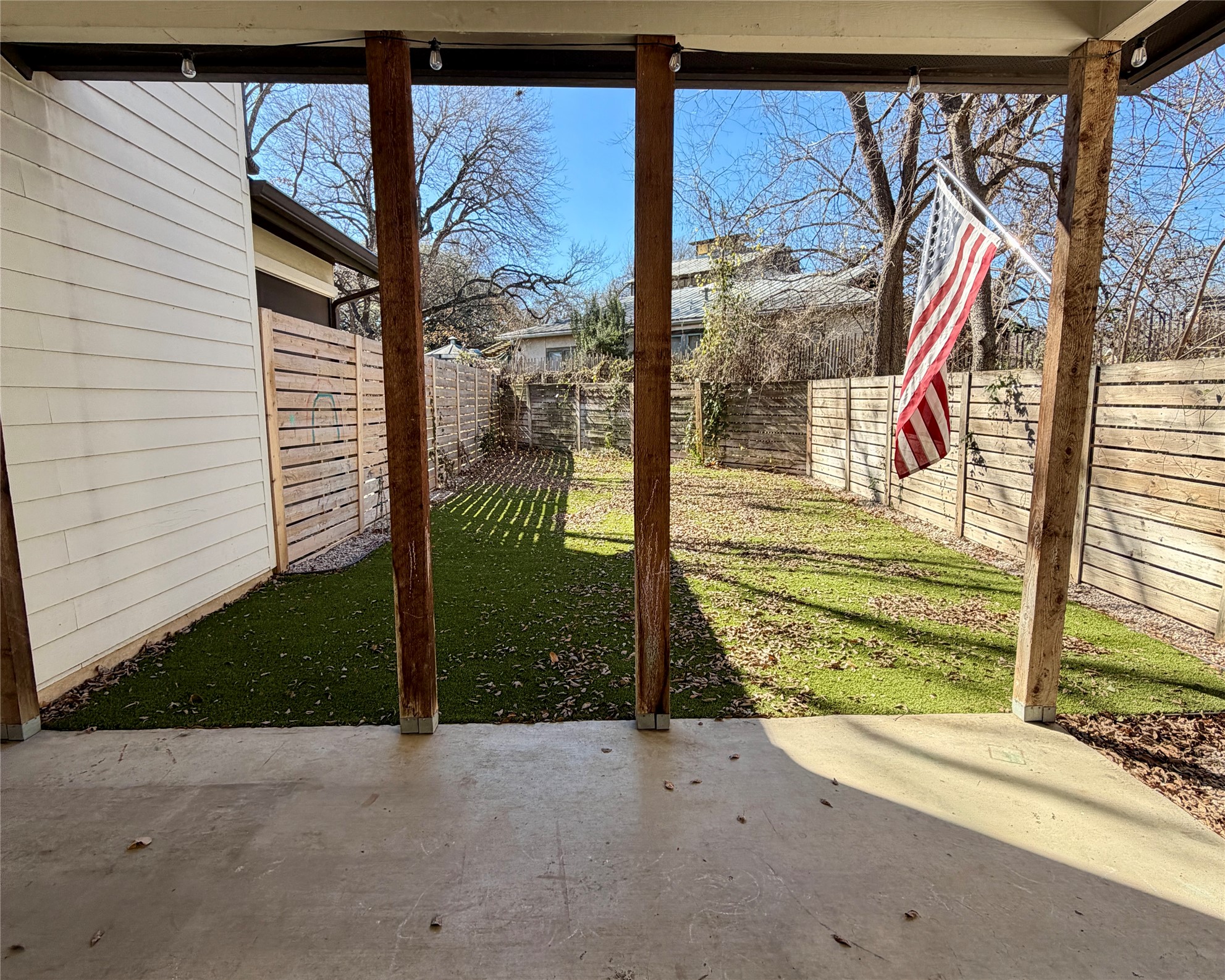 1515 Hether Street, Unit B Austin, TX 78704 - Photo 27 of 30 A well-maintained lawn is enclosed by privacy fencing, perfect for outdoor activities.