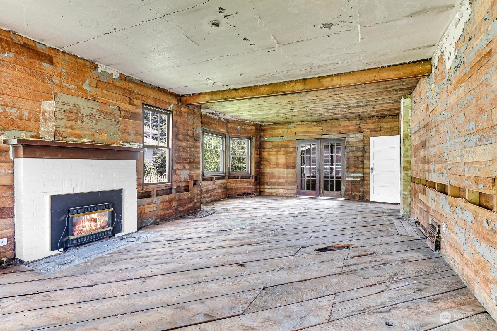 375 East Sunset Way Issaquah, WA 98027 - Photo 12 of 26 a hallway with fireplace and wooden floor