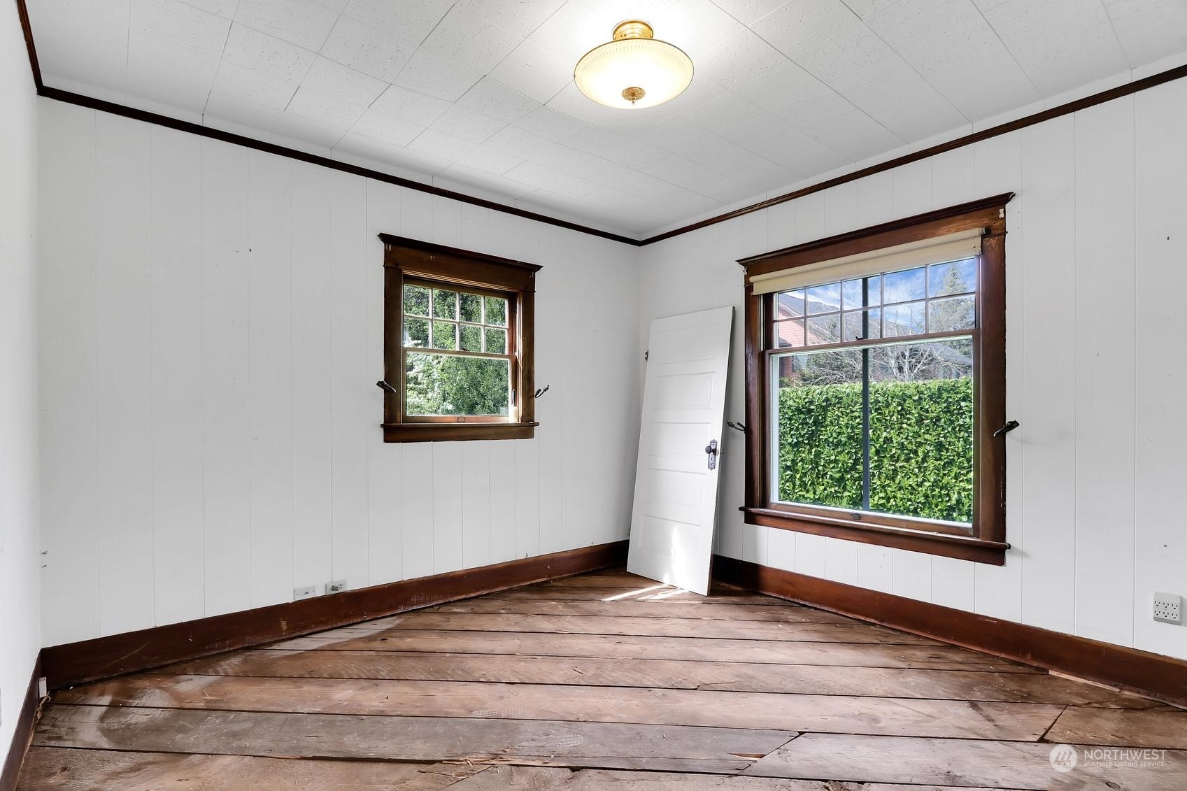 375 East Sunset Way Issaquah, WA 98027 - Photo 15 of 26 an empty room with wooden floor and windows