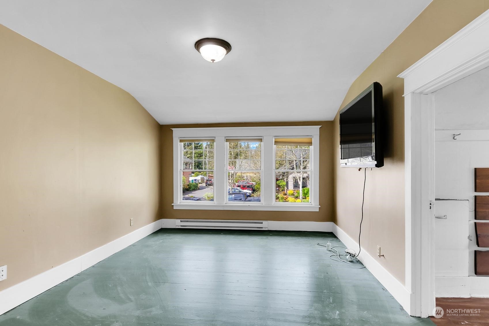 375 East Sunset Way Issaquah, WA 98027 - Photo 18 of 26 wooden floor in an empty room with a window