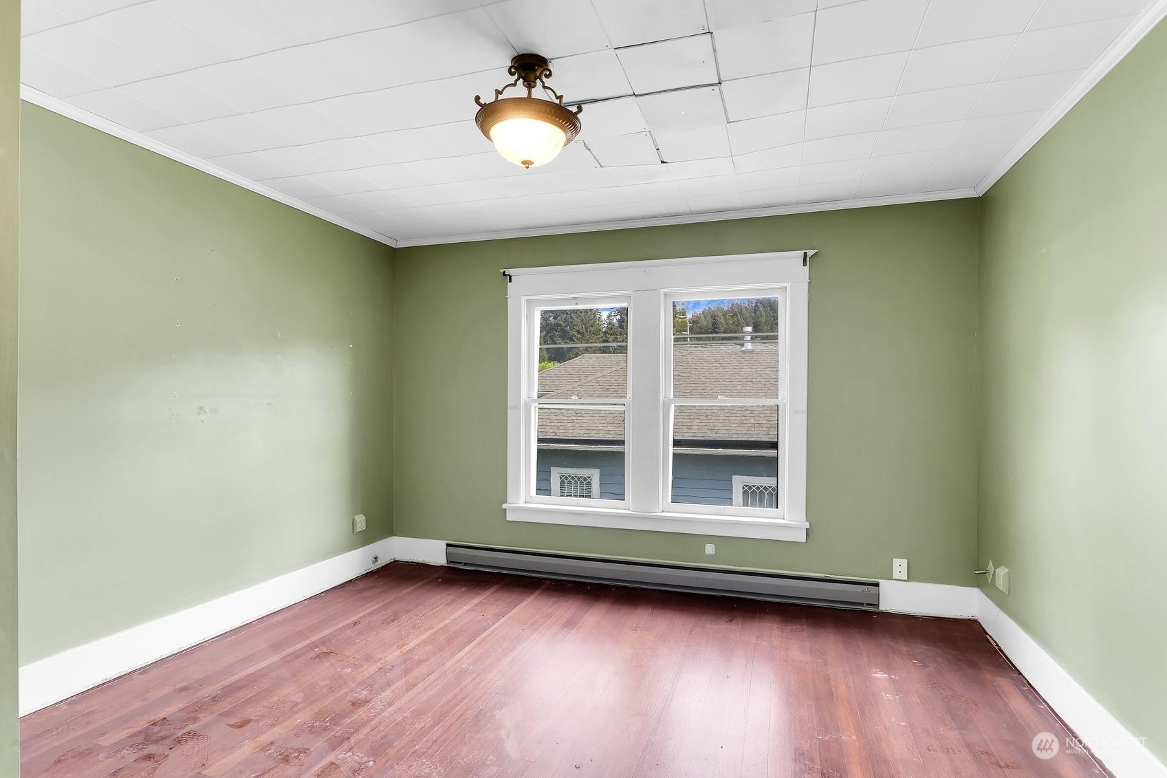 375 East Sunset Way Issaquah, WA 98027 - Photo 21 of 26 an empty room with wooden floor and windows