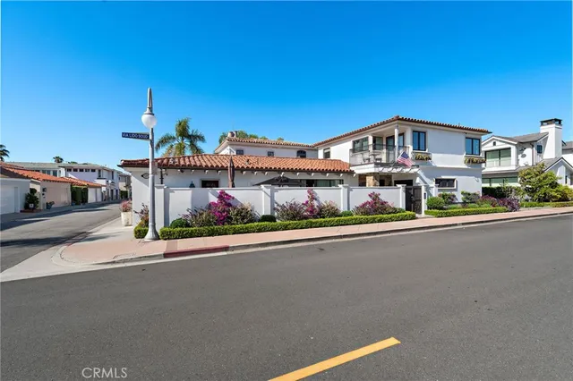 a front view of building with small garden