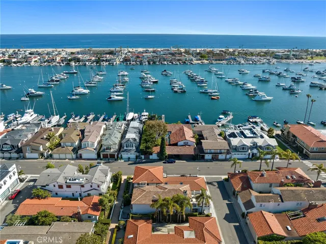 an aerial view of a house with a lake view