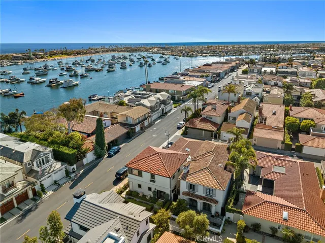 an aerial view of a city with ocean view