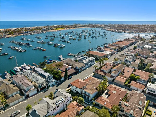 an aerial view of a city with ocean view