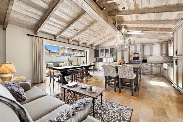 a living room with lots of furniture and a large window