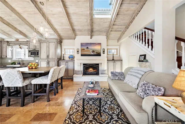a living room with furniture fireplace and a flat screen tv