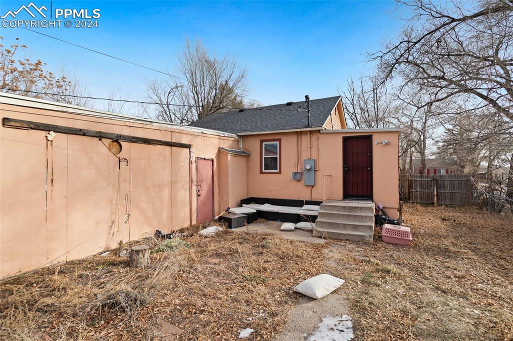 928 Alexander Road Colorado Springs, CO 80909 - Photo 23 of 24 a view of a house with backyard and sitting area