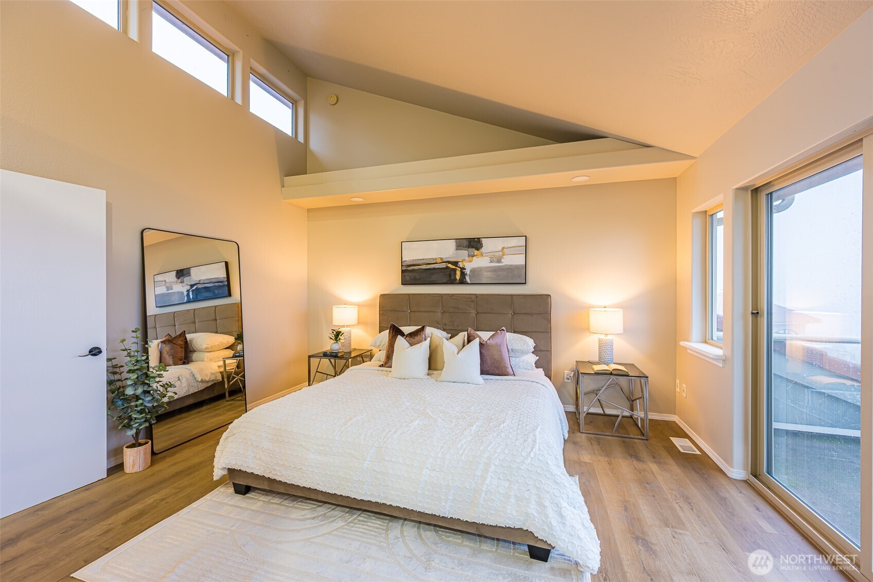 315 Quails Roost Road Sequim, WA 98382 - Photo 12 of 34 a bedroom with a bed and wooden floor