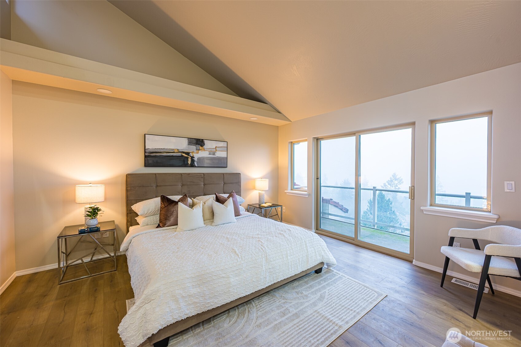 315 Quails Roost Road Sequim, WA 98382 - Photo 13 of 34 a bedroom with a large bed and a large window