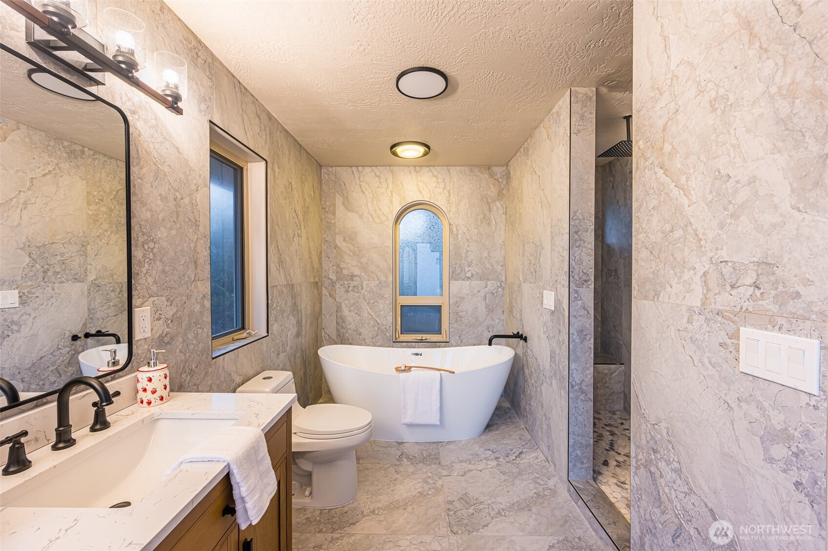 315 Quails Roost Road Sequim, WA 98382 - Photo 15 of 34 a bathroom with a toilet sink and mirror