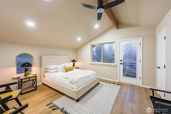 a living room with a bed furniture and a window