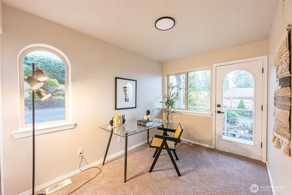 a work room with furniture and a window