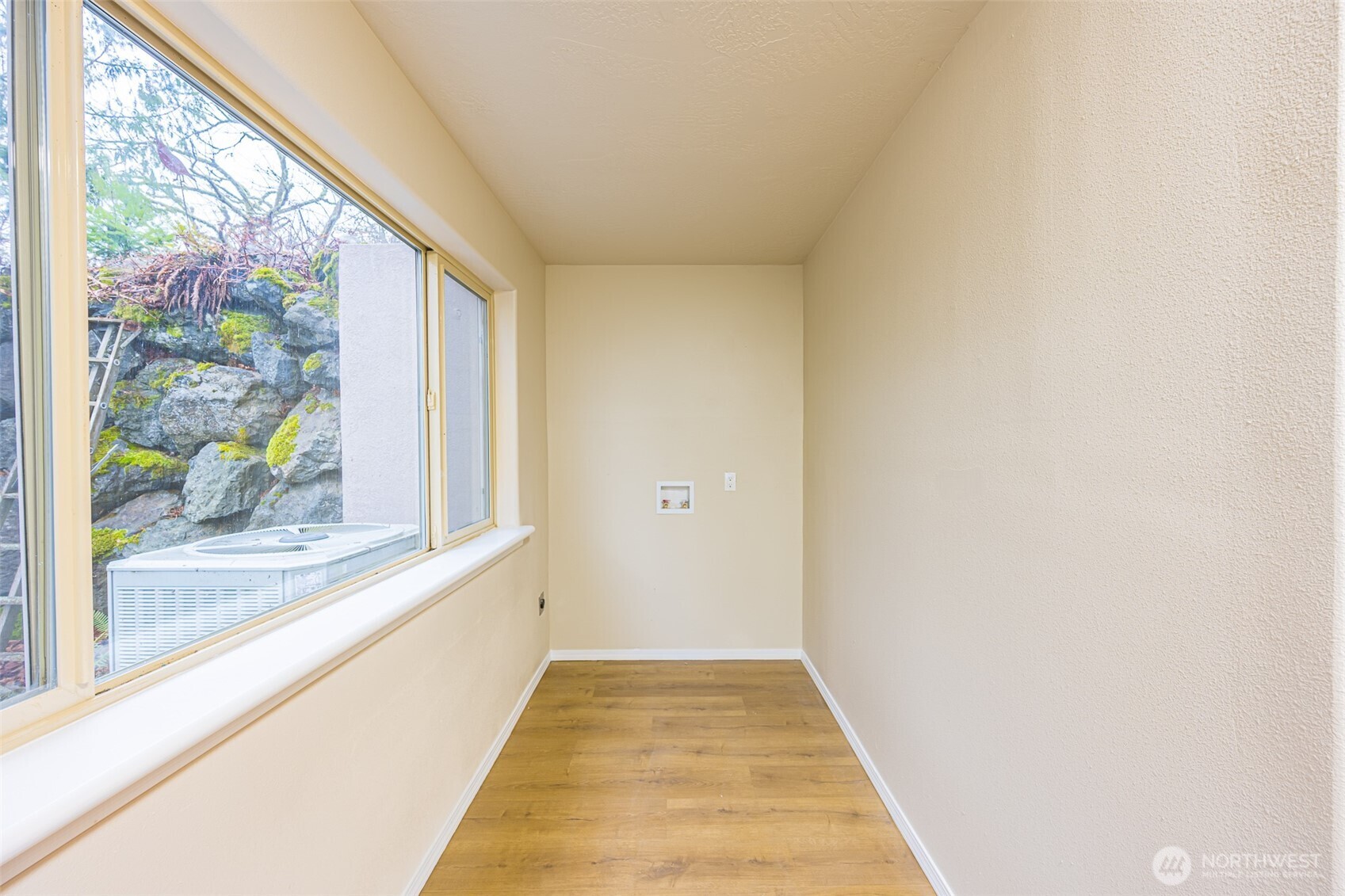 315 Quails Roost Road Sequim, WA 98382 - Photo 25 of 34 a view of a hallway with wooden floor and a window