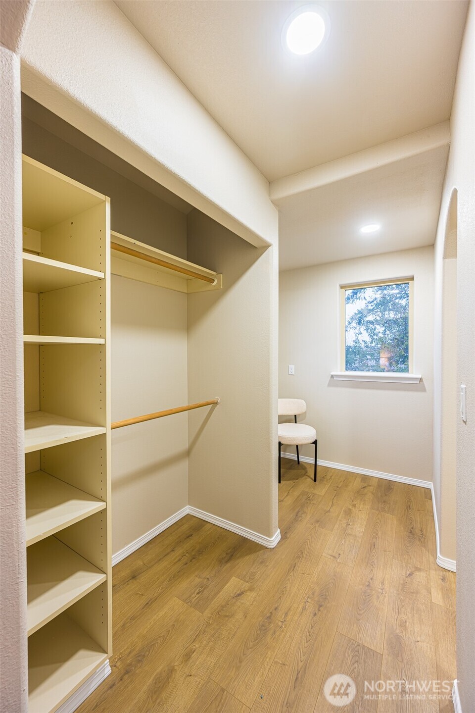 315 Quails Roost Road Sequim, WA 98382 - Photo 28 of 34 a view of an empty room with wooden floor and a window