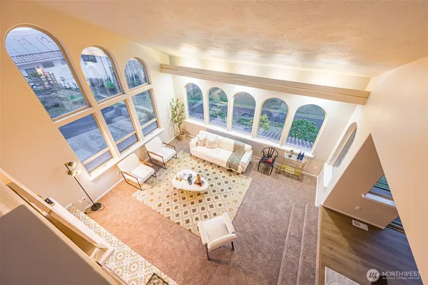 a view of a balcony with wooden floor and furniture