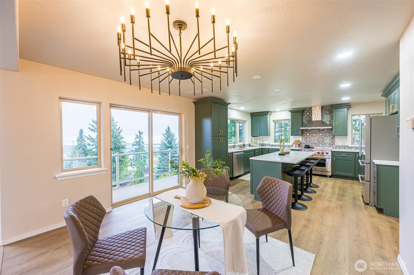315 Quails Roost Road Sequim, WA 98382 - Photo 7 of 34 a dining room with furniture a floor to ceiling window and wooden floor