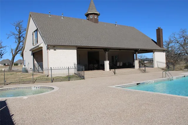 a view of a house with a sink and a yard