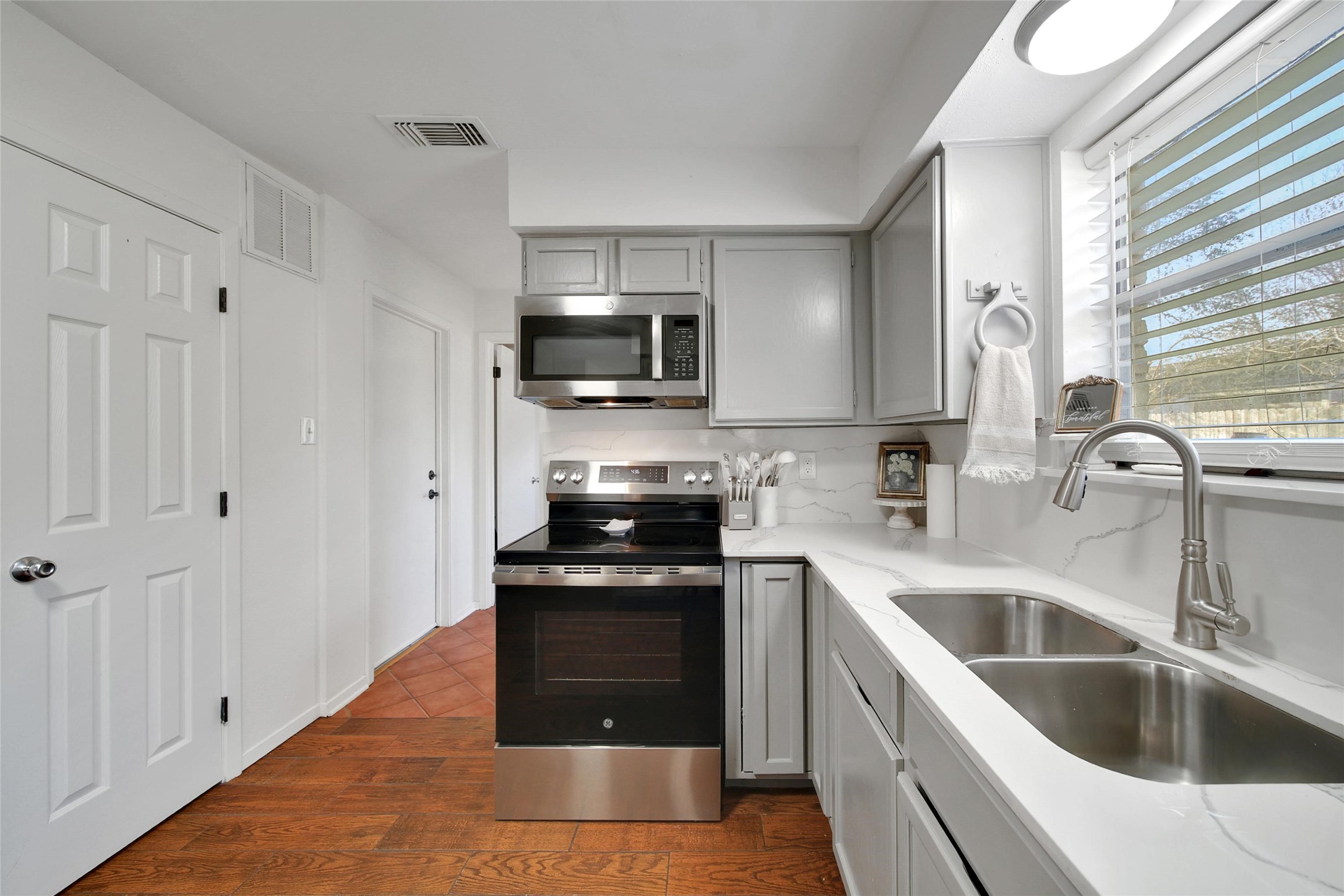 4206 Pineville Lane Spring, TX 77388 - Photo 15 of 35 a kitchen with a sink stove and microwave