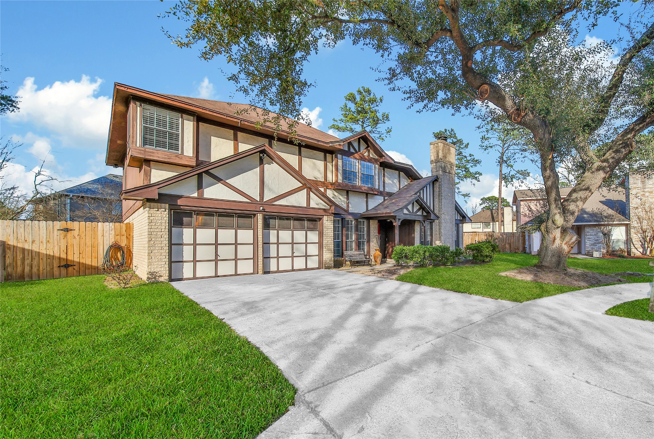 4206 Pineville Lane Spring, TX 77388 - Photo 2 of 35 a view of a big house with a big yard and large trees