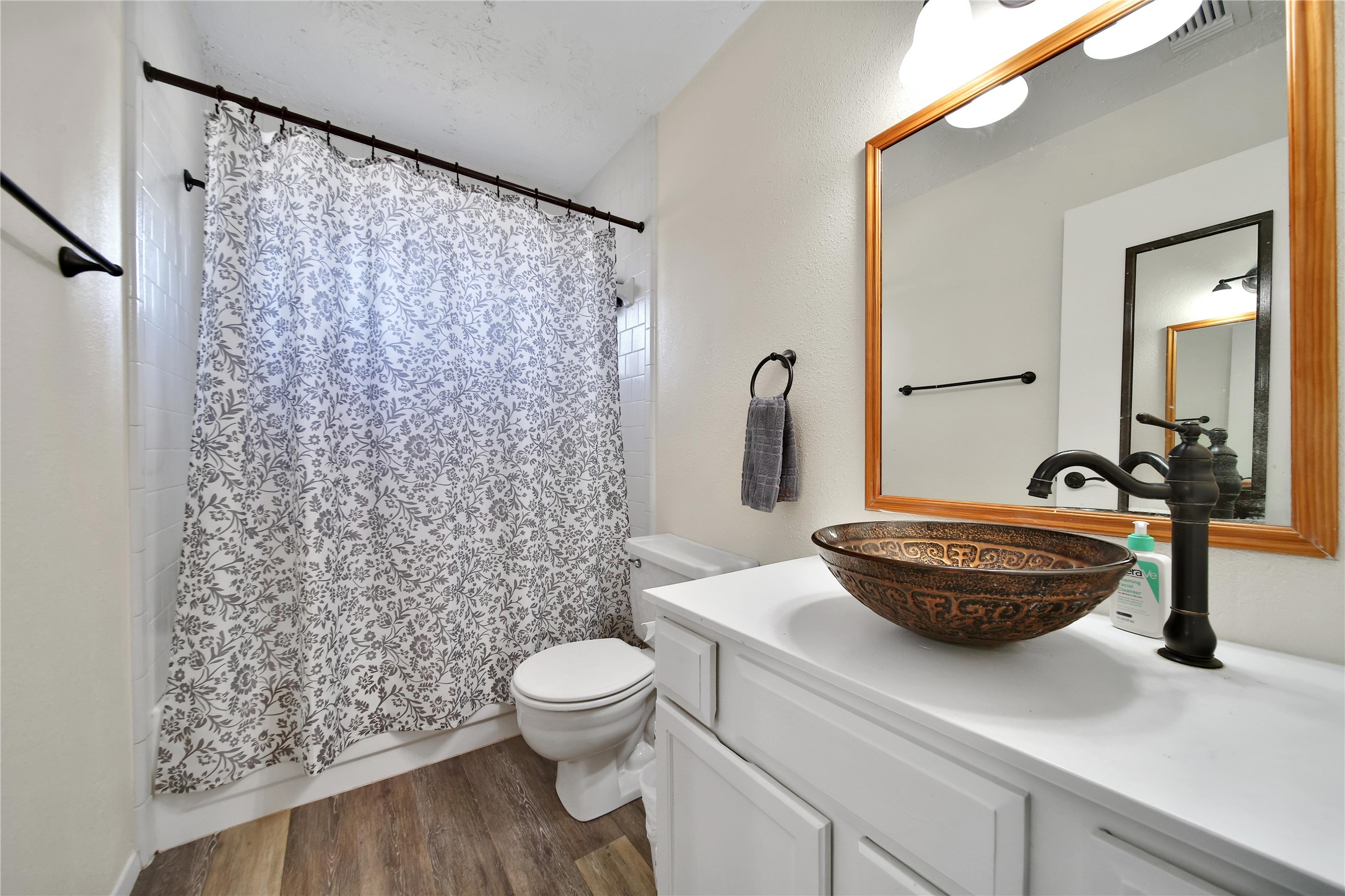 4206 Pineville Lane Spring, TX 77388 - Photo 28 of 35 a bathroom with a sink a toilet and shower curtain