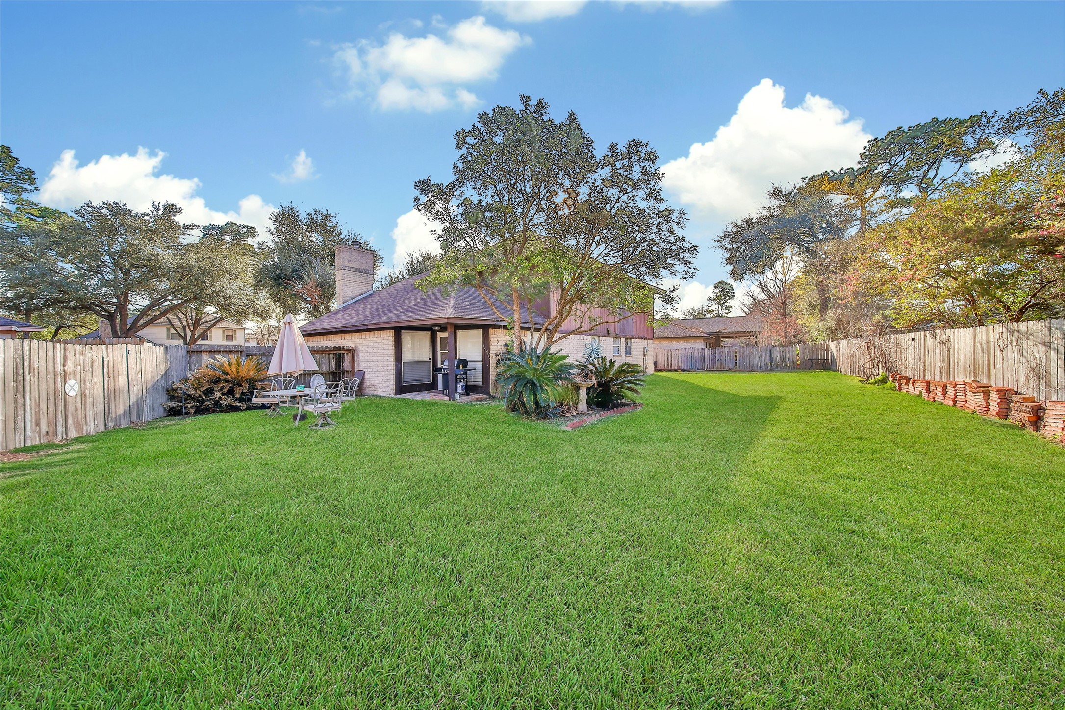 4206 Pineville Lane Spring, TX 77388 - Photo 33 of 35 a view of a house with backyard and a tree