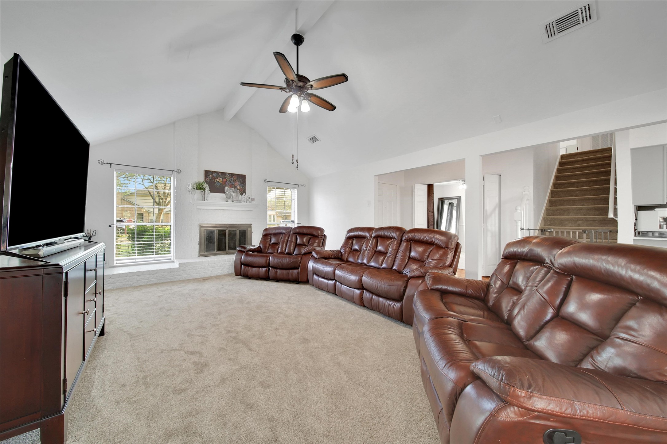 4206 Pineville Lane Spring, TX 77388 - Photo 8 of 35 a living room with furniture a flat screen tv and a large window