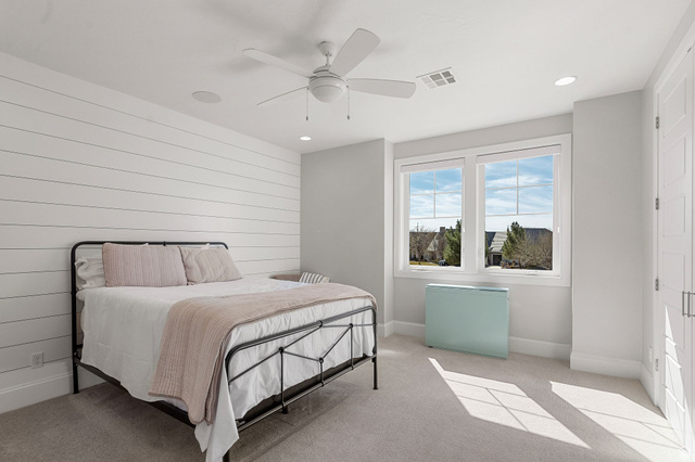 2917 Old Farm Road Washington, UT 84780 - Photo 72 of 105 Bedroom featuring light carpet, a ceiling fan, wooden walls, and recessed lighting