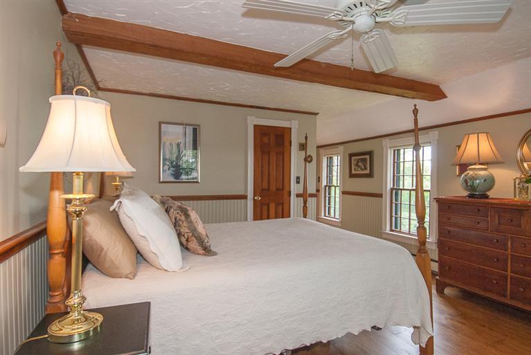 127 Point Hill Road West Barnstable, MA 02668 - Photo 21 of 29 a bedroom with a bed and a chandelier