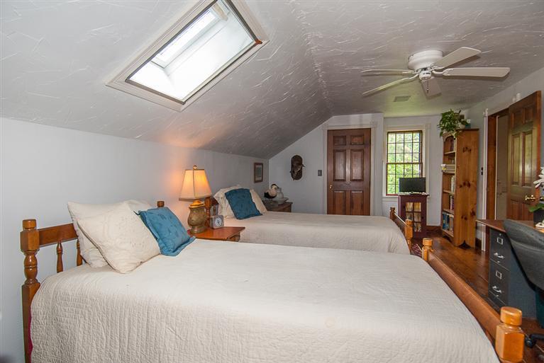 127 Point Hill Road West Barnstable, MA 02668 - Photo 23 of 29 a bedroom with a large bed and a chandelier